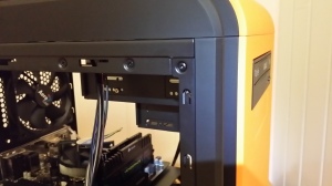 Aligning the optical drive with the front panel.